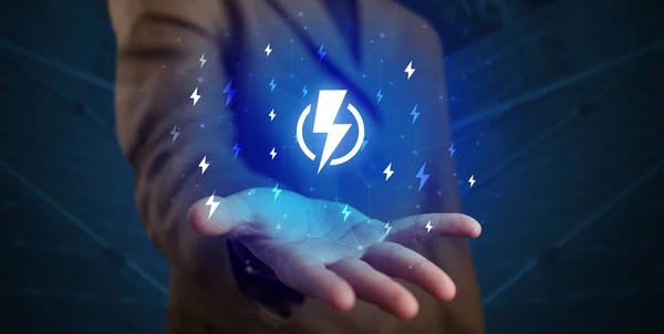 Hand holding lightning bolt — Stock Photo, Image
