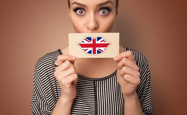 Person holding UK flag card