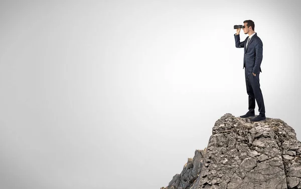 Business person on the top of the rock with copy space — Stock Photo, Image