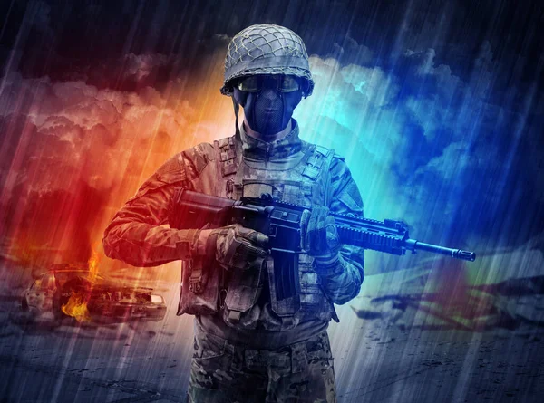 Armed soldier standing in the middle of dust storm — Stock Photo, Image