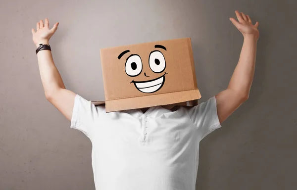 Young boy with happy cardboard box face — Stock Photo, Image