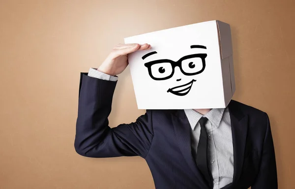 Young man with happy cardboard box face — Stock Photo, Image