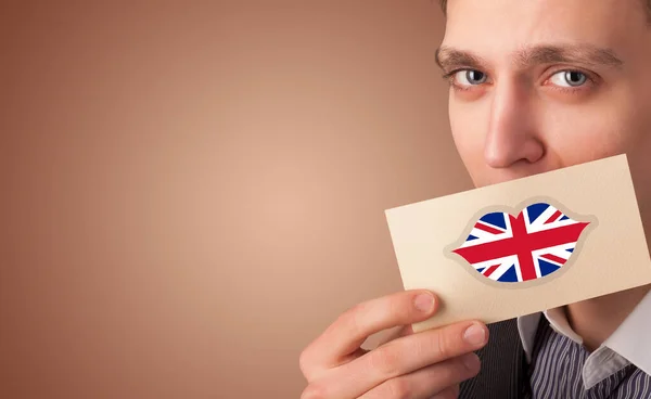 Birleşik Krallık bayrak kartı tutan kişi — Stok fotoğraf
