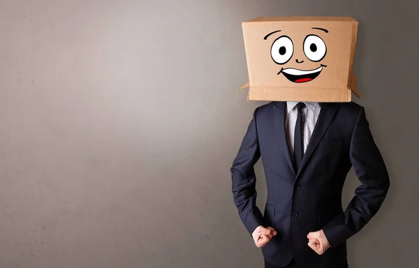 Young boy with happy cardboard box face — Stock Photo, Image