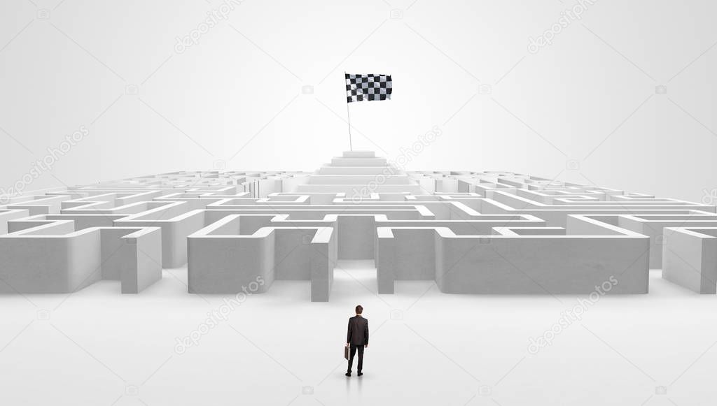 Man standing outside of a maze with pirate flag