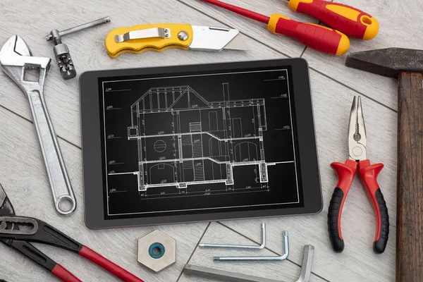 Tablet and tools with blueprint concept — Stock Photo, Image