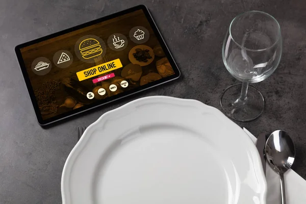 Online food order concept on laid table