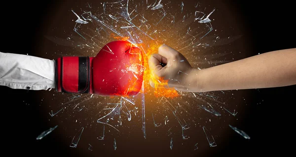 Fighting hands breaking glass — Stock Photo, Image