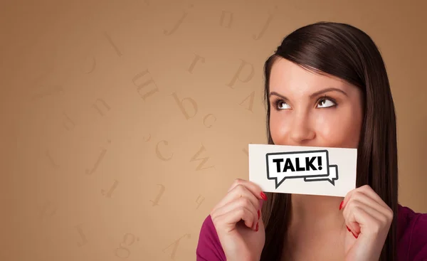 Persona con tarjeta delante de su boca — Foto de Stock