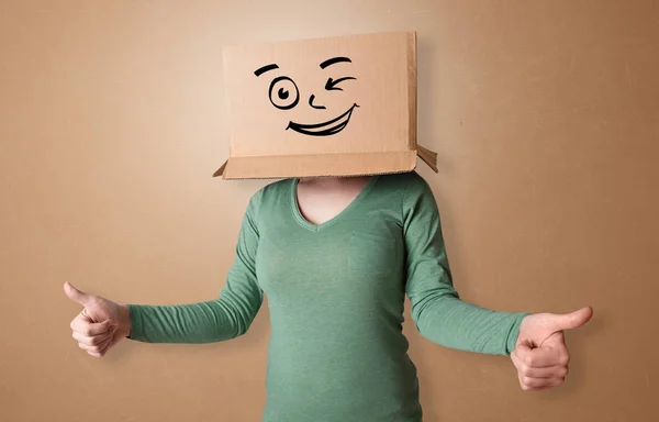 Young woman with happy cardboard box face — Stock Photo, Image