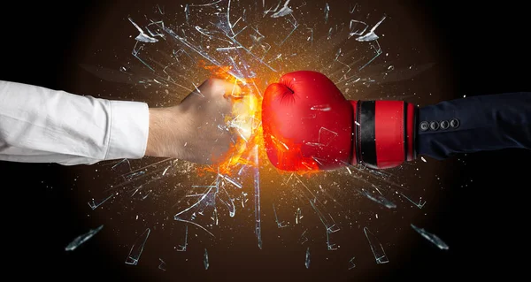 Fighting hands breaking glass — Stock Photo, Image