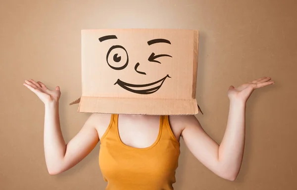 Young woman with happy cardboard box face — Stock Photo, Image