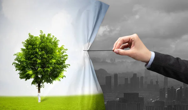 Hand pulling nature cityscape curtain to gray cityscape — Stock Photo, Image