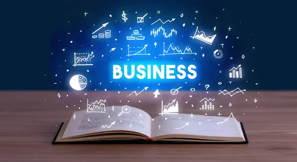 Business inscription coming out from an open book — Stock Photo, Image