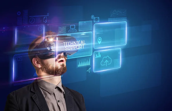 Businessman looking through Virtual Reality glasses, tech concept — Stock Photo, Image
