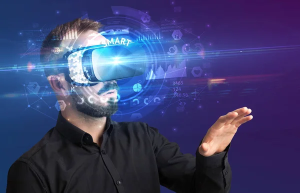 Businessman looking through VR glasses — Stock Photo, Image