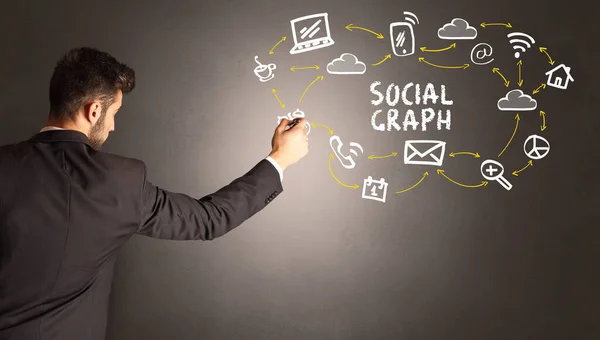Geschäftsmann zeichnet Social-Media-Ikonen — Stockfoto