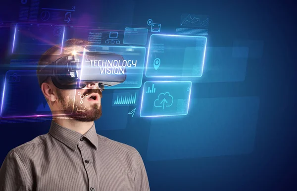 Businessman looking through Virtual Reality glasses, tech concept — Stock Photo, Image