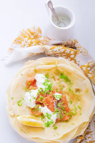 Crepes with smoked salmon. — Stock Photo, Image