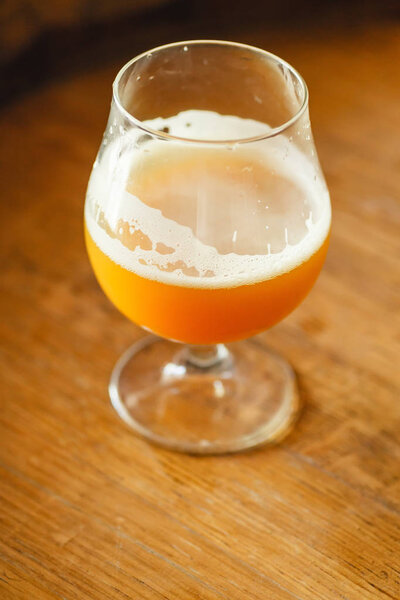 Wheat ale on a wooden barrel