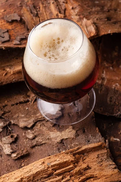 Dark beer on bark