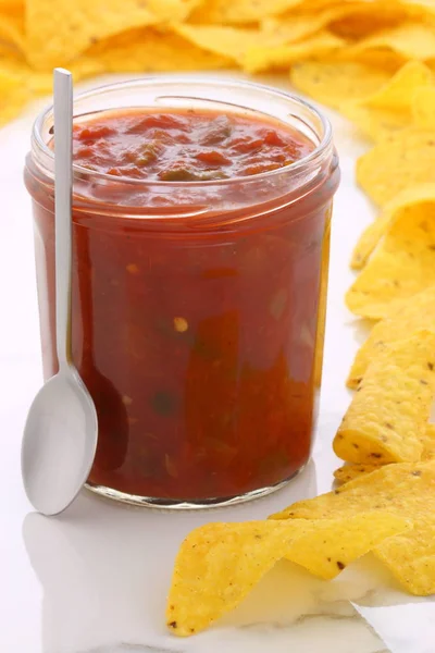 Delicious hot salsa dip and nachos — Stock Photo, Image