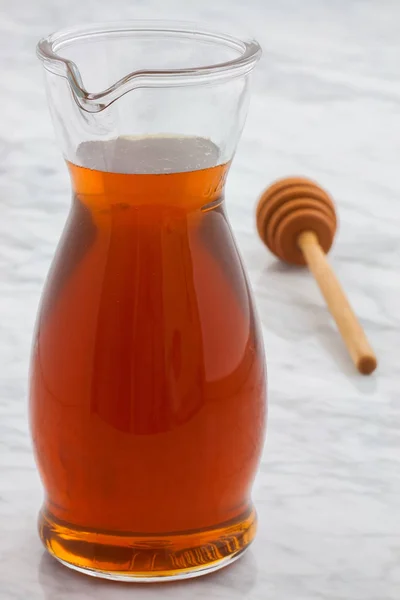 Honning eller ahornsirup - Stock-foto