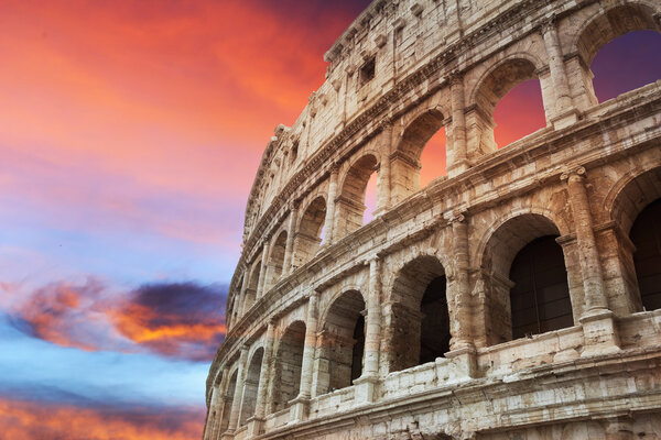 Coliseum fragment at beautiful red sunset, Rome, Italy