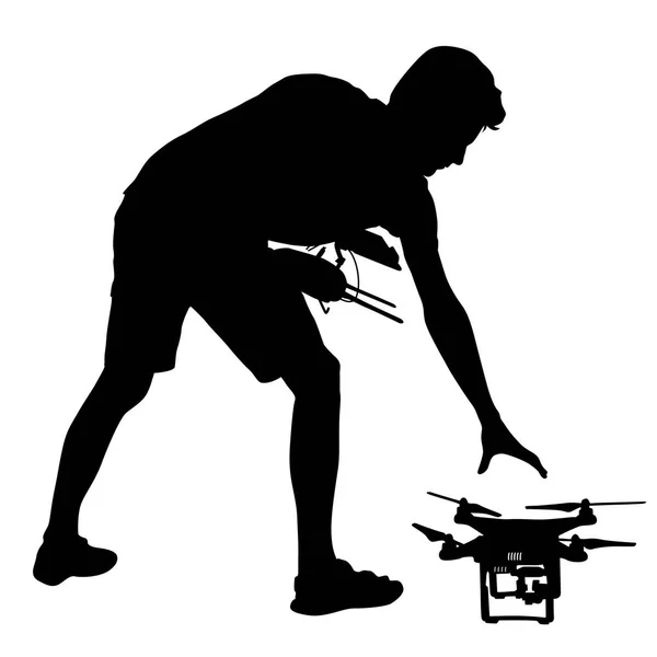 Siyah bir adam silüeti insansız quadcopter vektör çizim çalışır — Stok Vektör