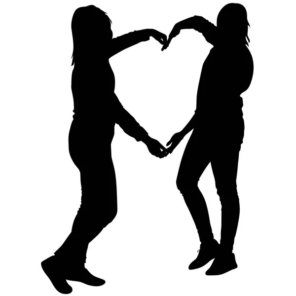 心臓の形、ベクトル図で手を繋いでいる二人の女の子をシルエットします。 — ストックベクタ