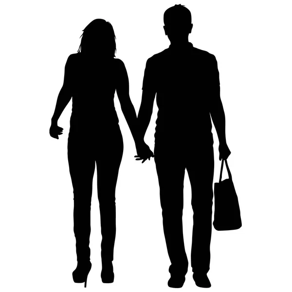 Silueta hombre y mujer caminando de la mano — Vector de stock
