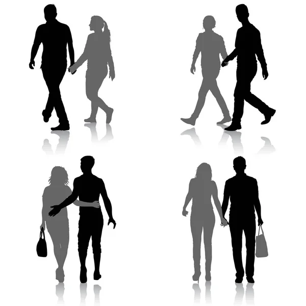 Set Silhouette homme et femme marchant main dans la main — Image vectorielle