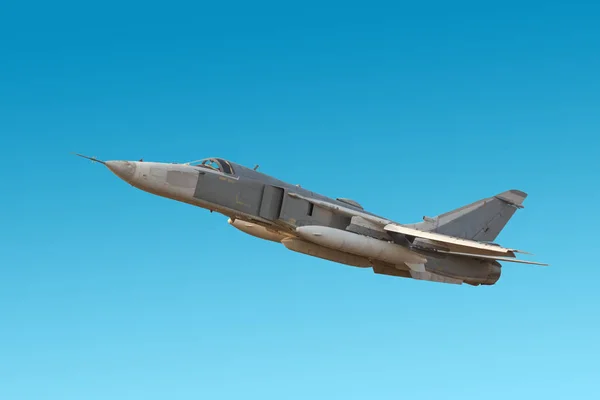 Military jet bomber Su-24 Fencer flying a blue background