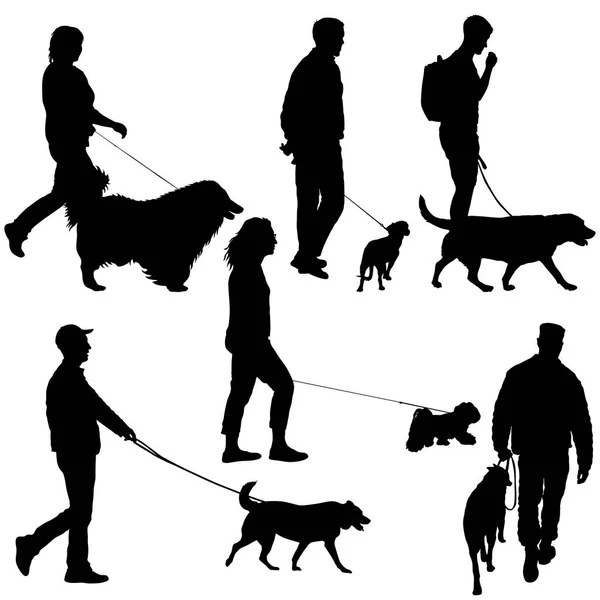 Definir silhueta de pessoas e cães em um fundo branco — Vetor de Stock