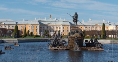 ST. PETERSBURG, RUSSIA, May 12, 2018: Time lapse Petergof or Peterhof, known as Petrodvorets from 1944 to 1997 and Neptune Fountain on May 12, 2018 in St. Petersburg, Russia