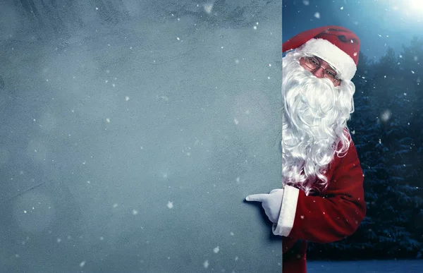 Babbo Natale che punta sul banner vuoto — Foto Stock