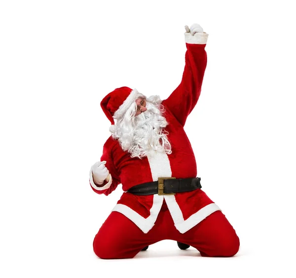 Glad jultomte glidande på knäna — Stockfoto