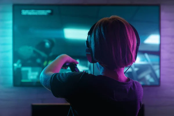 Little boy playing video game at night — Stock Photo, Image