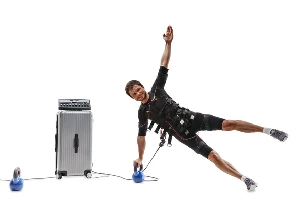 EMS fitness man doing a two point side plank on dumbbell — Stock Photo, Image