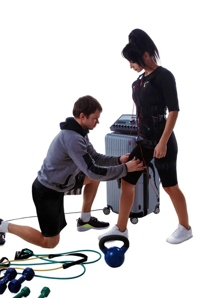 Trainer helps attaching ems — Stock Photo, Image