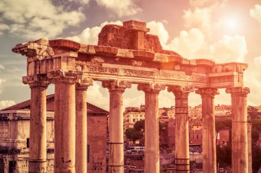 Ruins of temple of Saturn at the Roman Forum in Rome clipart