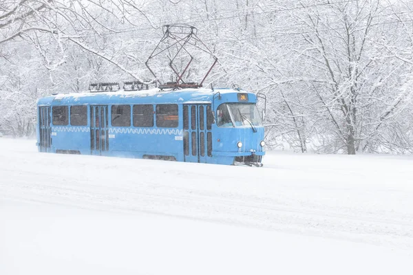 Tram goes along the street during snowstorm in Moscow — Stock Photo, Image