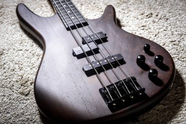 Bass electric guitar with four strings. Popular rock musical ins