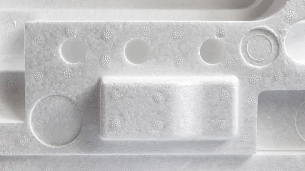 Polystyrene or styrofoam padding for product packaging. Detail of styrene foam plastic box close-up. White styrofoam cushion texture background. — Stock Image Polystyrene Styrofoam Padding Product Packaging Detail Styrene Foam Plastic Box Stock Image