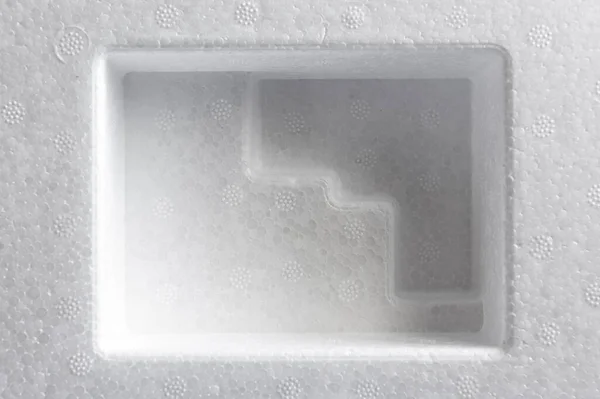 Polystyrene or styrofoam padding for product packaging. Detail of styrene foam plastic box close-up. White styrofoam cushion texture background. — Stock Image Polystyrene Styrofoam Padding Product Packaging Detail Styrene Foam Plastic Box Royalty Free Stock Images