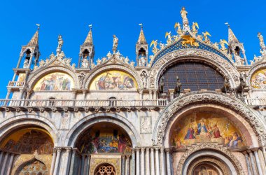 St Mark`s Basilica in Venice, Italy. Famous Saint Mark`s cathedral is top tourist attraction of Venice. Old building with beautiful mosaics and statues. Luxury Renaissance facade of Venice landmark.