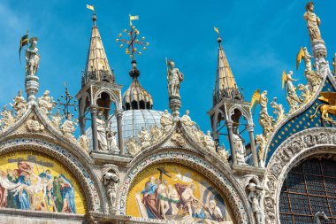 St Mark`s Basilica in Venice, Italy. Famous Saint Mark`s cathedral is top tourist attraction of Venice. Old building with beautiful mosaics and statues. Luxury Renaissance facade of Venice landmark.