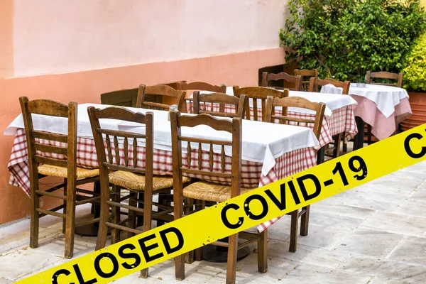 Street restaurant or cafe closed due to COVID-19 coronavirus disease. SARS-CoV-2 corona virus outbreak, countries impose quarantine and restrictions on movement during coronavirus pandemic.