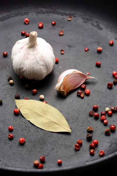 Garlic with pepper on a dark background — Stock Photo, Image