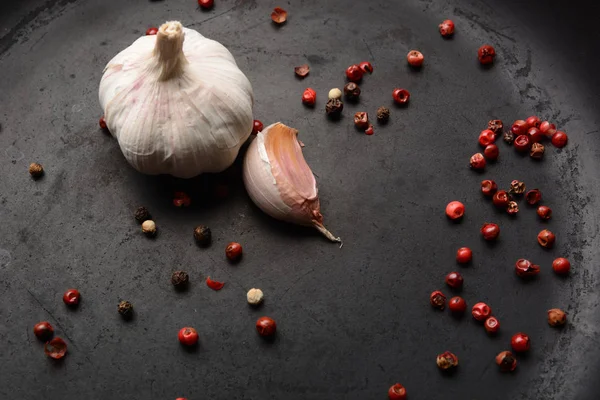 Garlic with pepper on a dark background — Stock Photo, Image